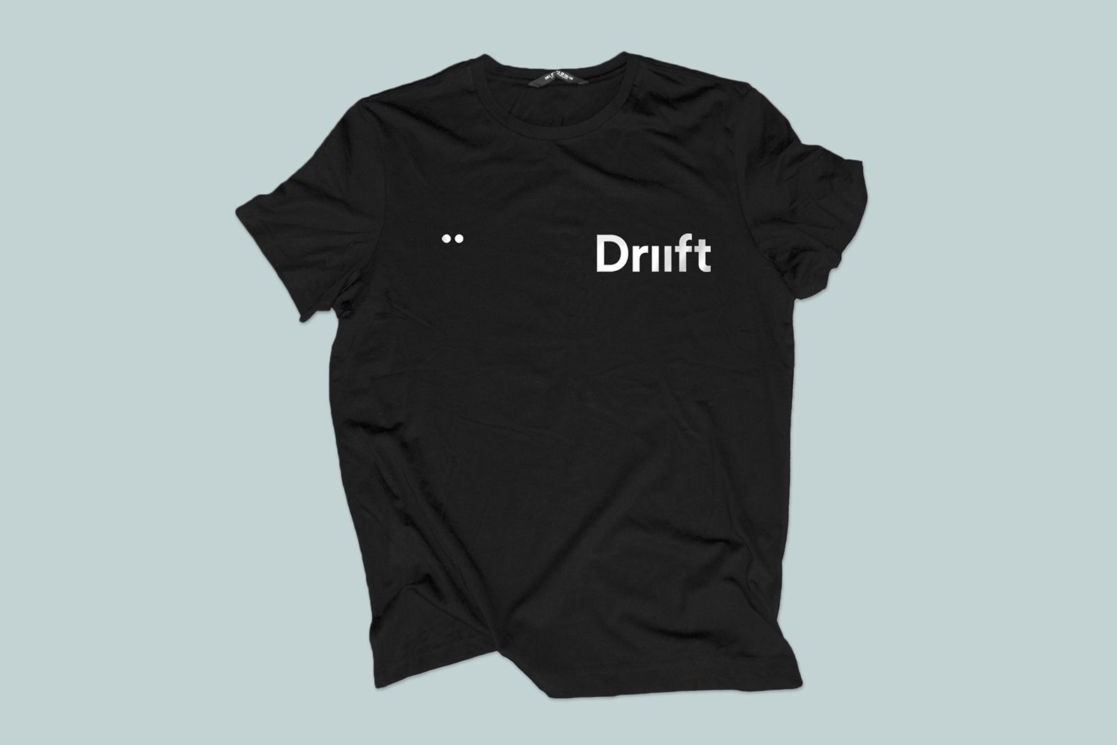 Merch design for Driift by O Street, Glasgow. Black T-shirt with white logo on chest. 