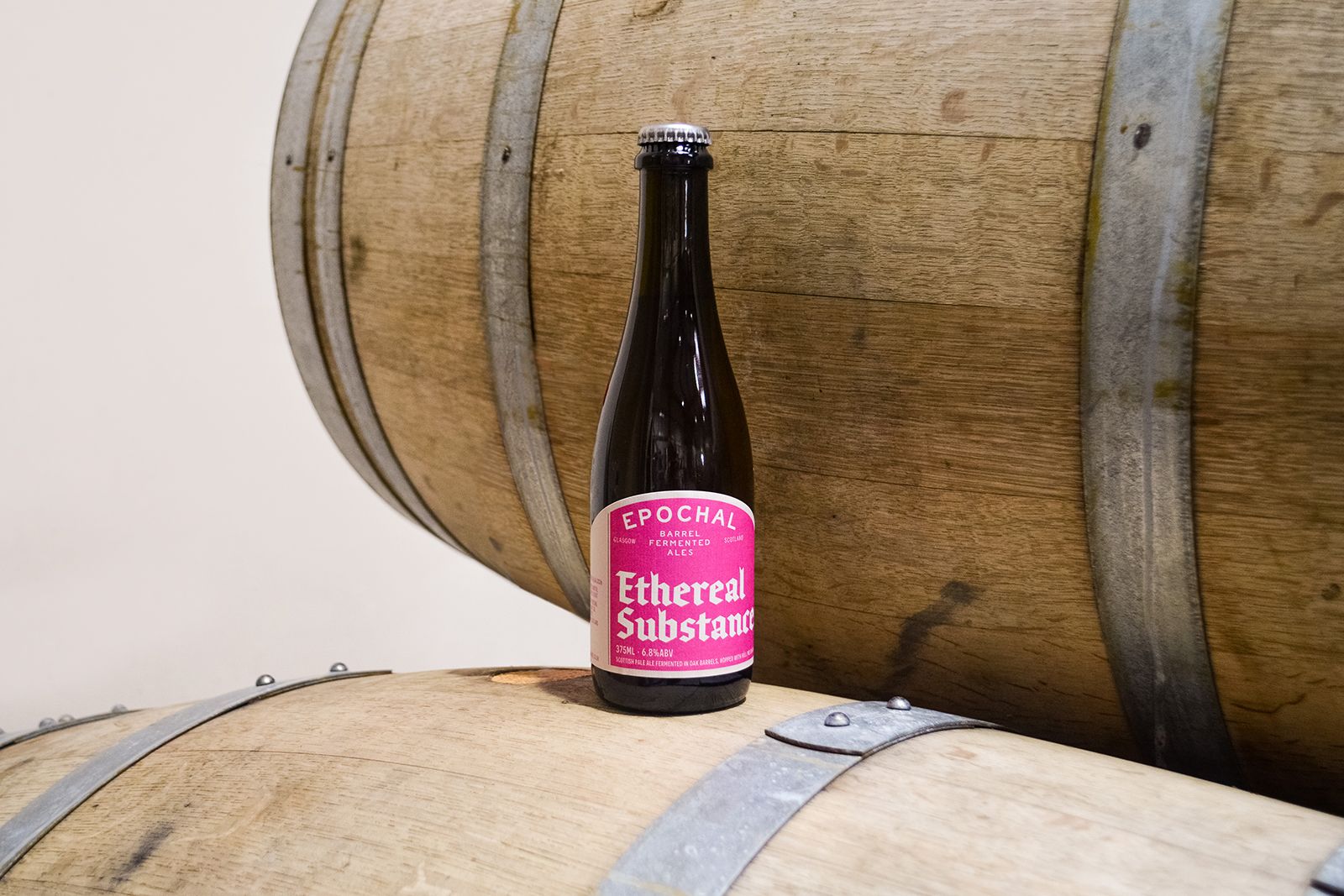O Street Packaging and Logo Design for Scottish Brewery Epochal. Ethereal Substance on a bright pink label sitting on a barrel.